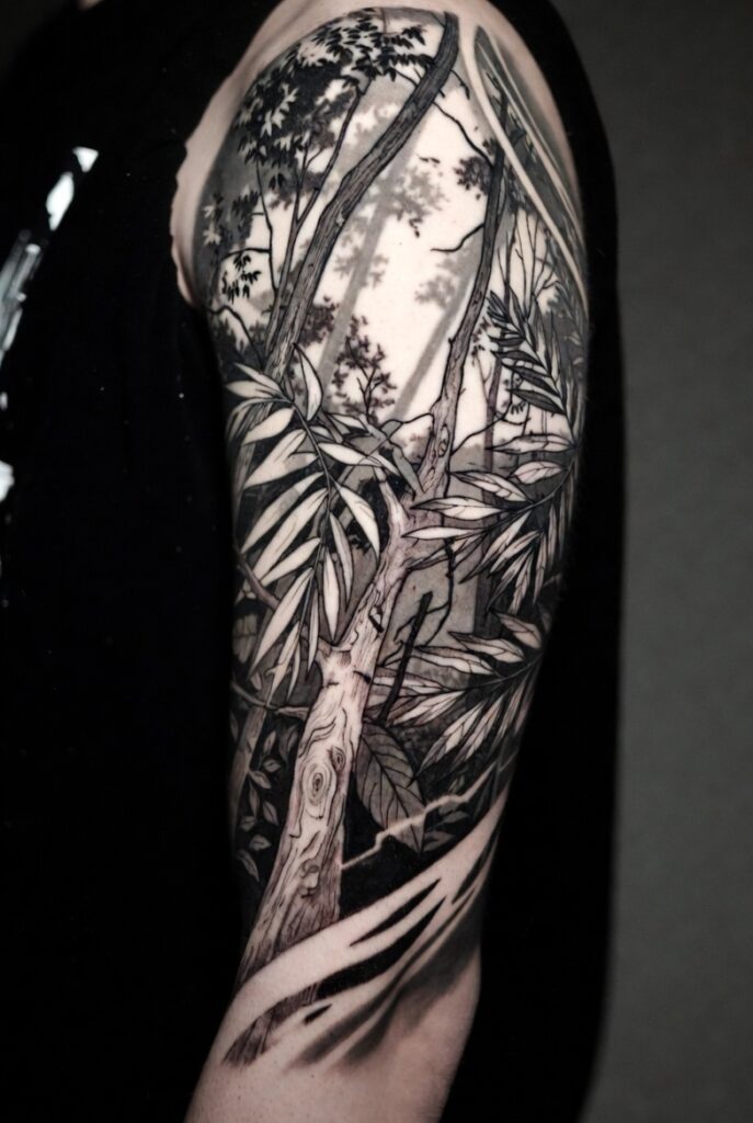 Detailed nature sleeve tattoo featuring forest, mountains, and wildlife, showcasing creative sleeve tattoo ideas that turn the arm into living art