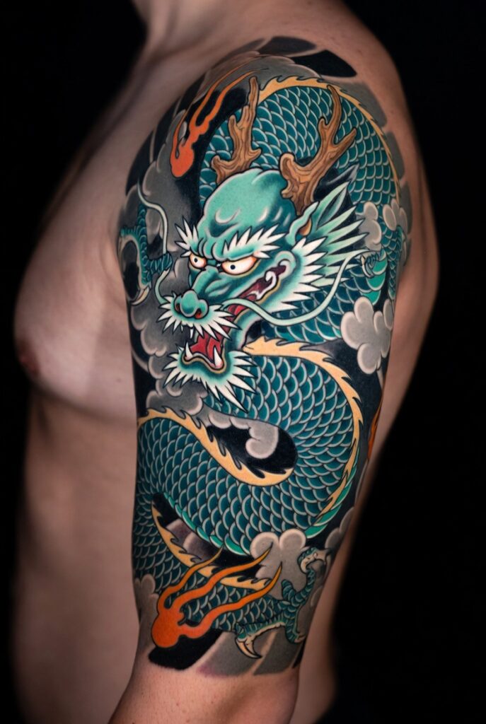 Japanese sleeve tattoo ideas featuring dragon, koi fish, and traditional irezumi designs on a muscular arm."