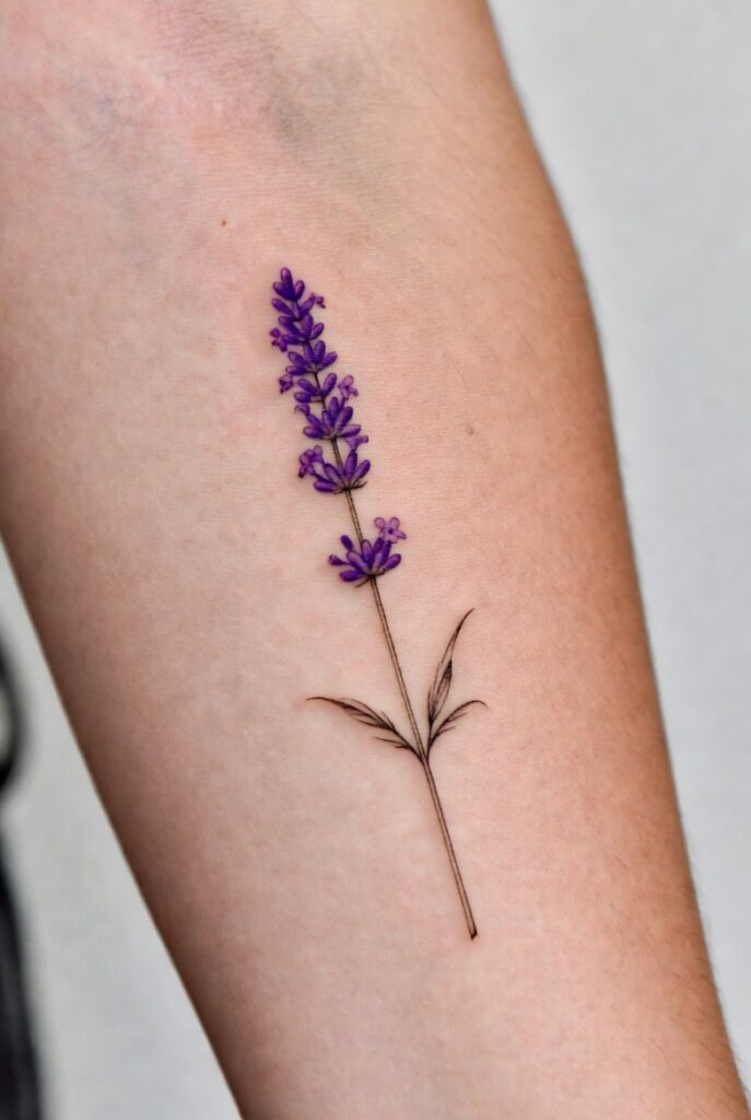 Delicate lavender sprig tattoo on the forearm, showcasing soft and elegant lavender tattoo ideas that prove ink can still be stunning